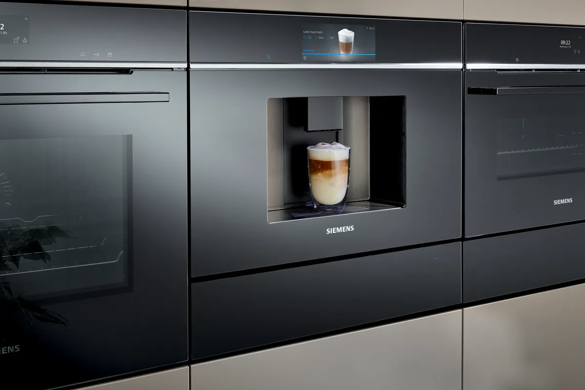 Siemens iQ700 built-in coffee machine serving a latte macchiato